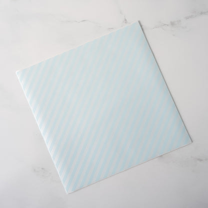 Light blue patterned deli paper on a white marble surface