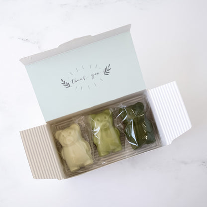 bakery box with three bear madeleines labeled &