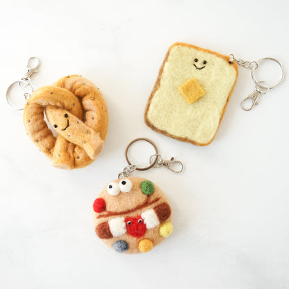 Chocolate candy cookie, butter toast, and pretzel shaped felt key rings