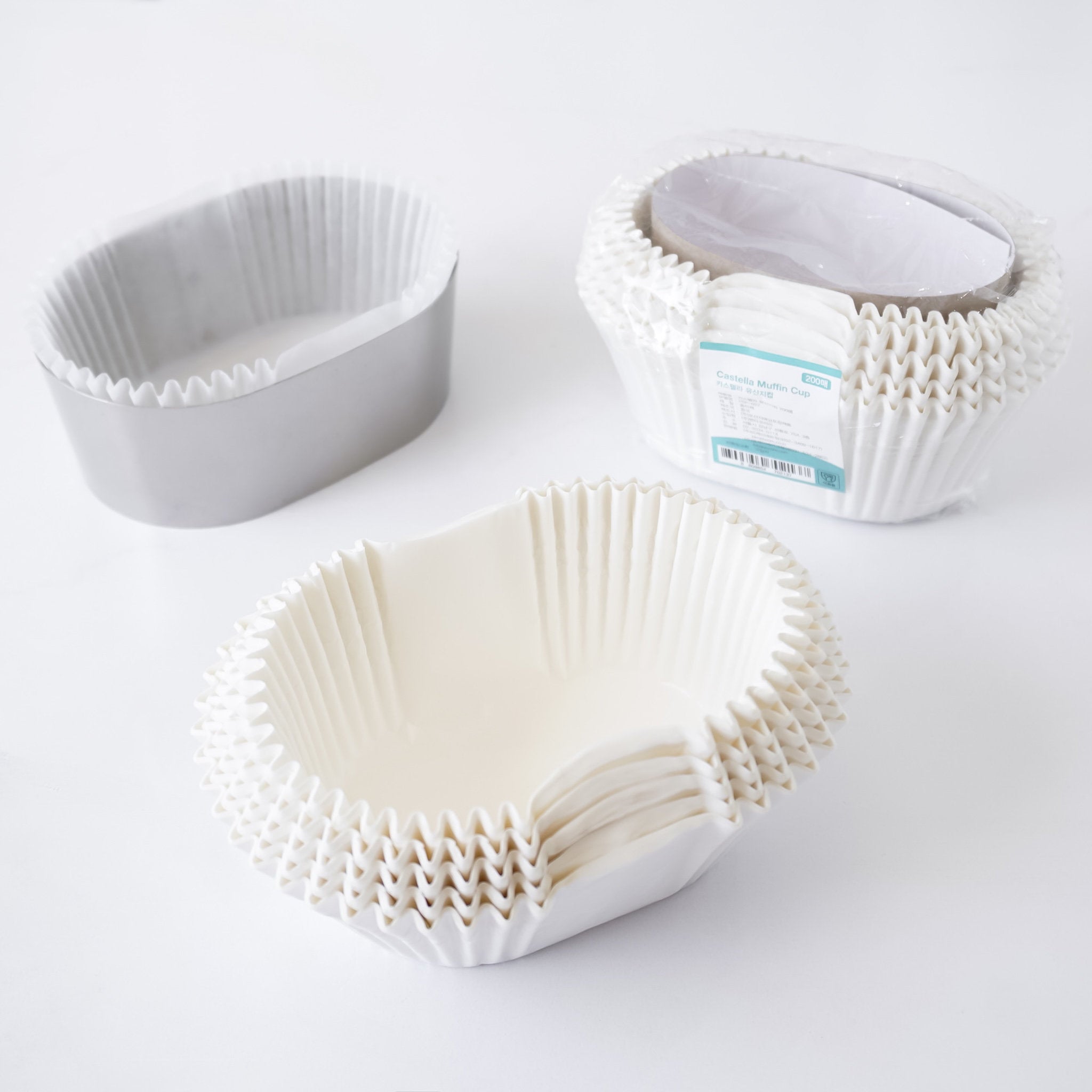 White paper baking cups on a white surface