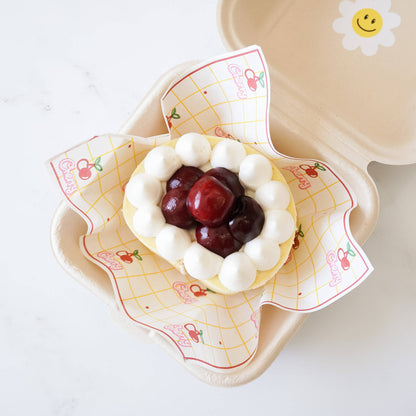 cherry roll cake, printed parchment paper