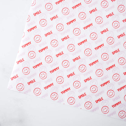 Pattern of smiley faces and text on a white background
