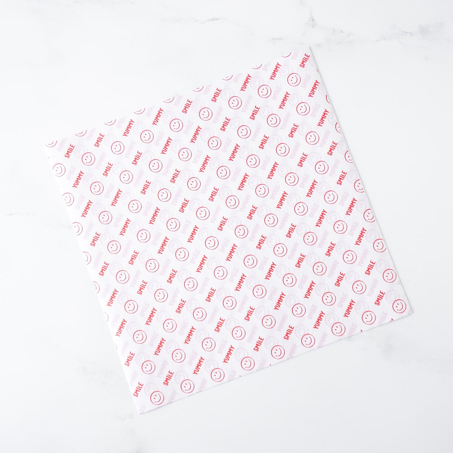 White deli paper with red text and logo on a white background