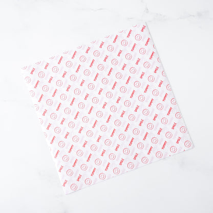 White deli paper with red text and logo on a white background