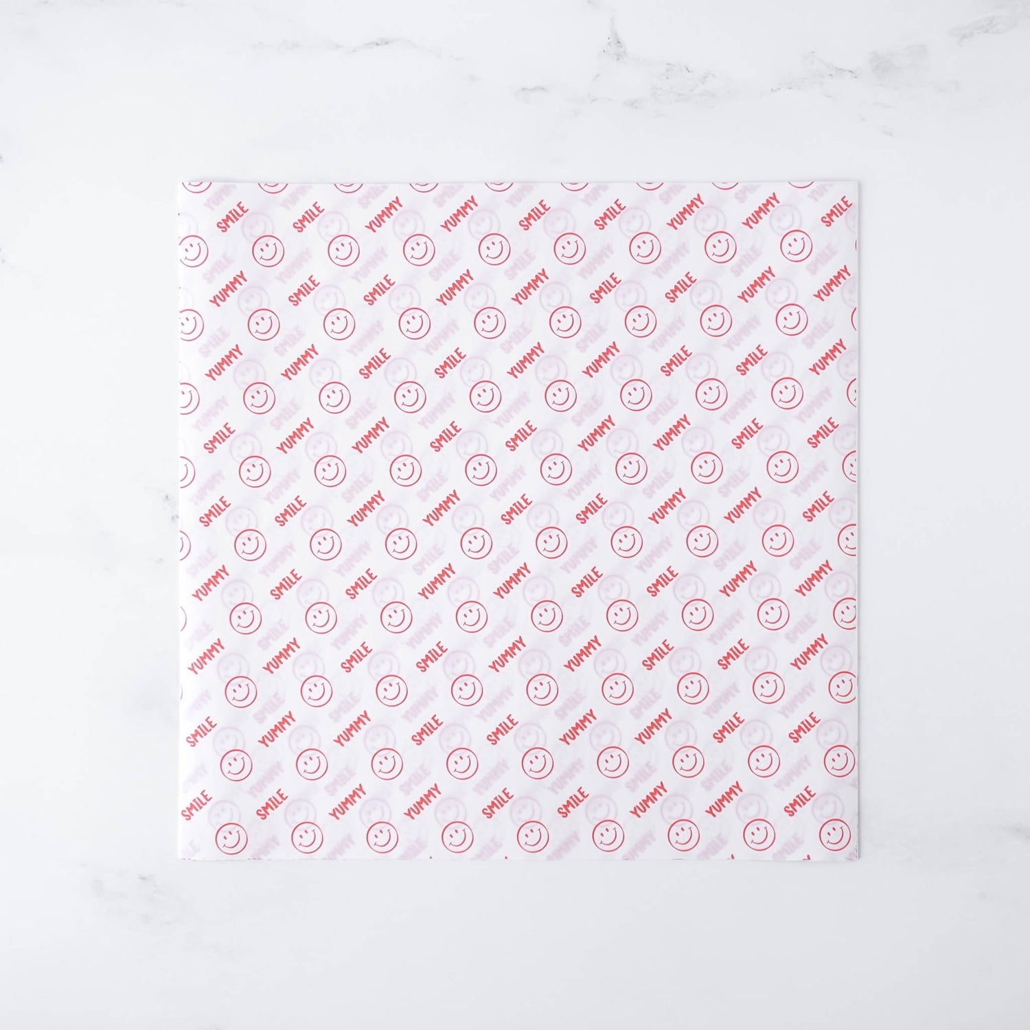 Smile patterned deli paper with red text and smiley faces on a white background