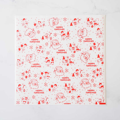 Red and white Christmas wrapping paper features a repeating pattern of Santa Claus illustrations and the phrase &