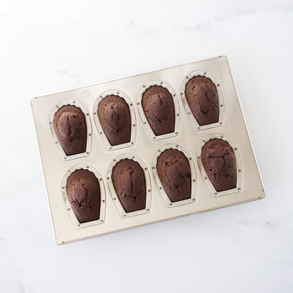 Madeleine cake mold with eight cavity on a white background