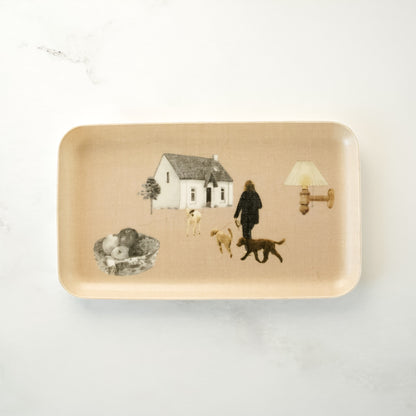 Rectangular tray with a design of a house, people, and dogs on a beige background