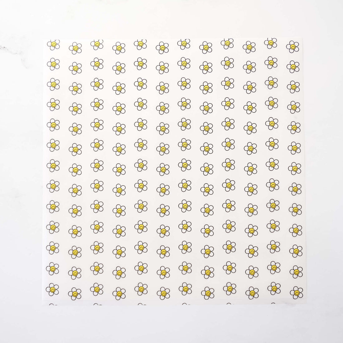 Pattern of small daisy flowers on a white background