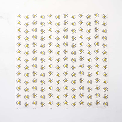 Pattern of small daisy flowers on a white background