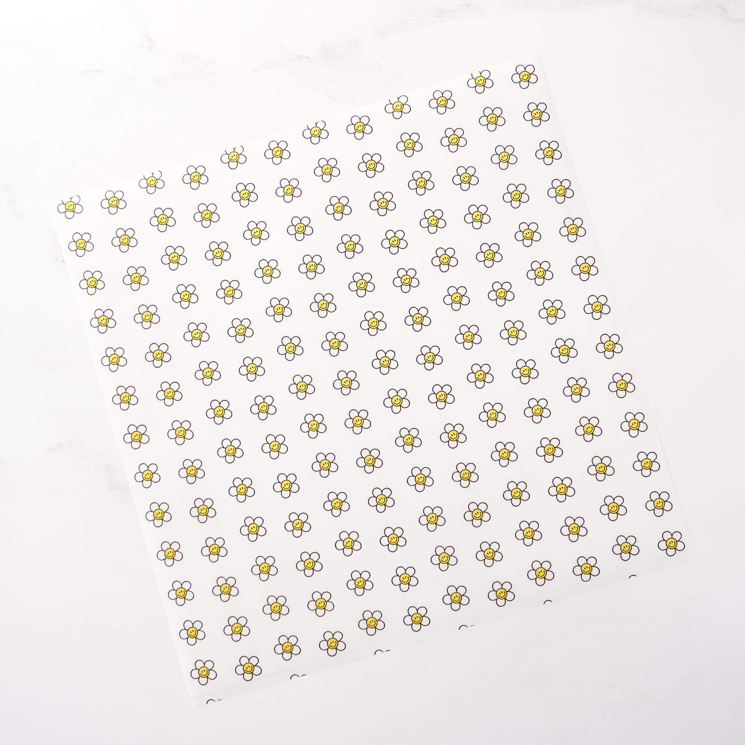 Pattern of small daisy flowers on a white background