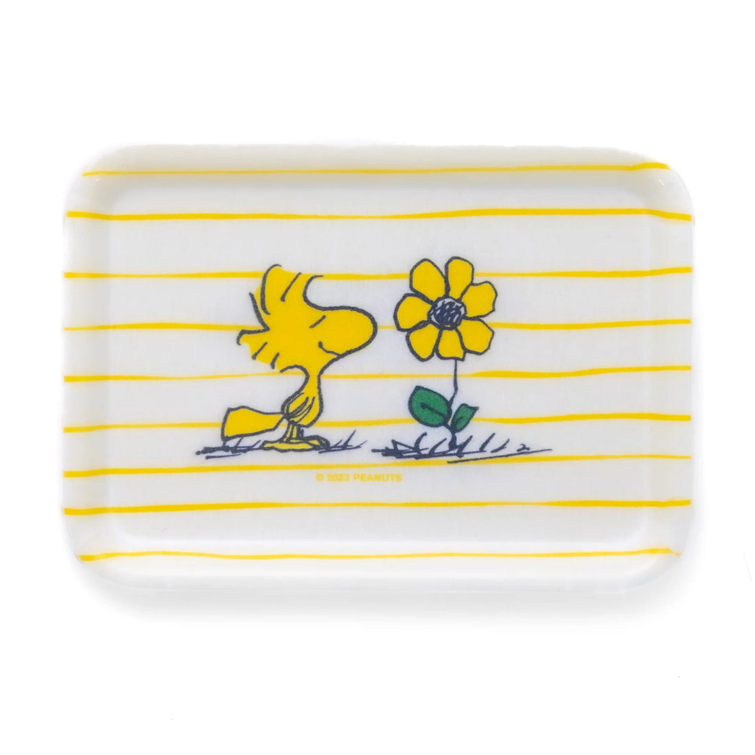 Rectangular plate with yellow stripes and Woodstock near a flower on a white background