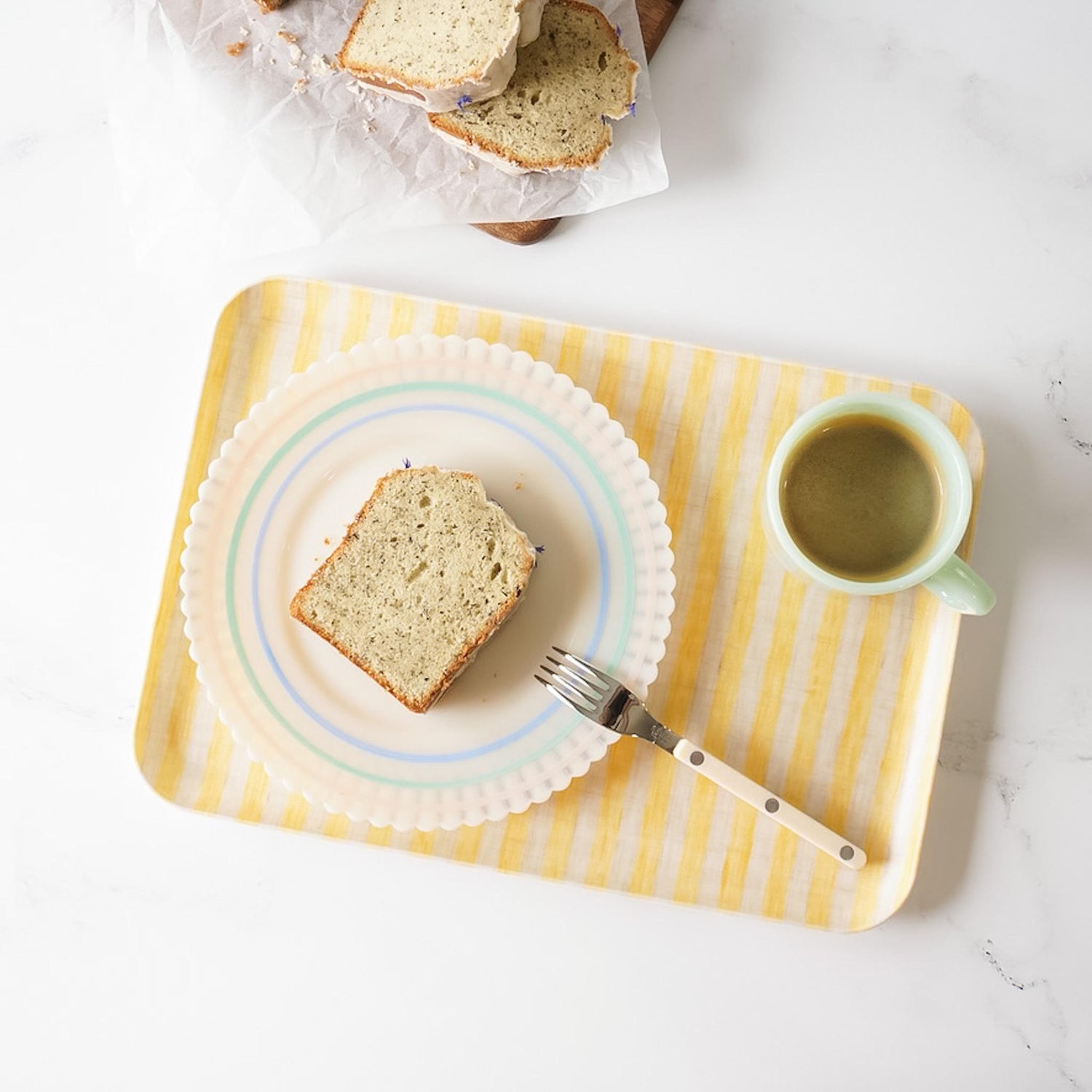 pound cake and coffee on a serving tray