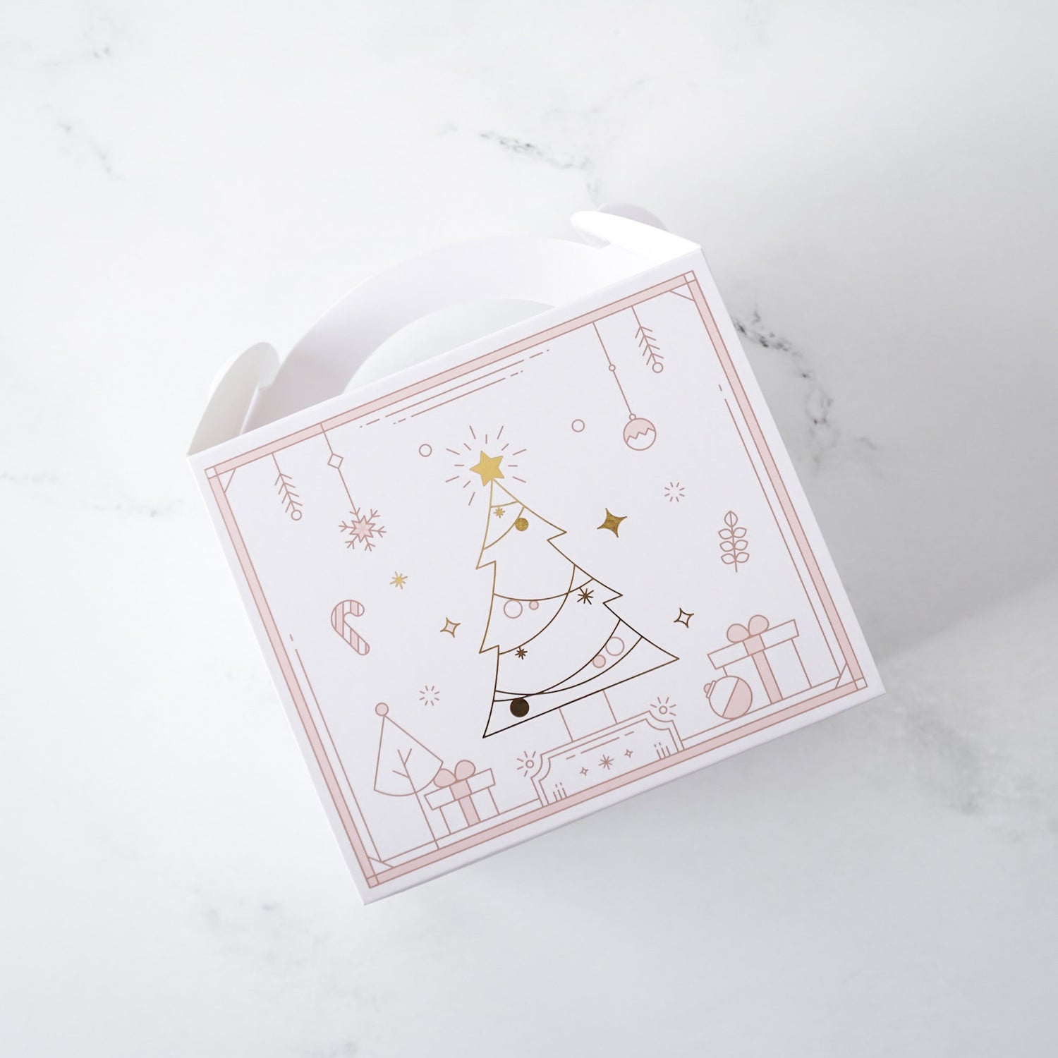White gable box with Christmas tree design on a marble surface