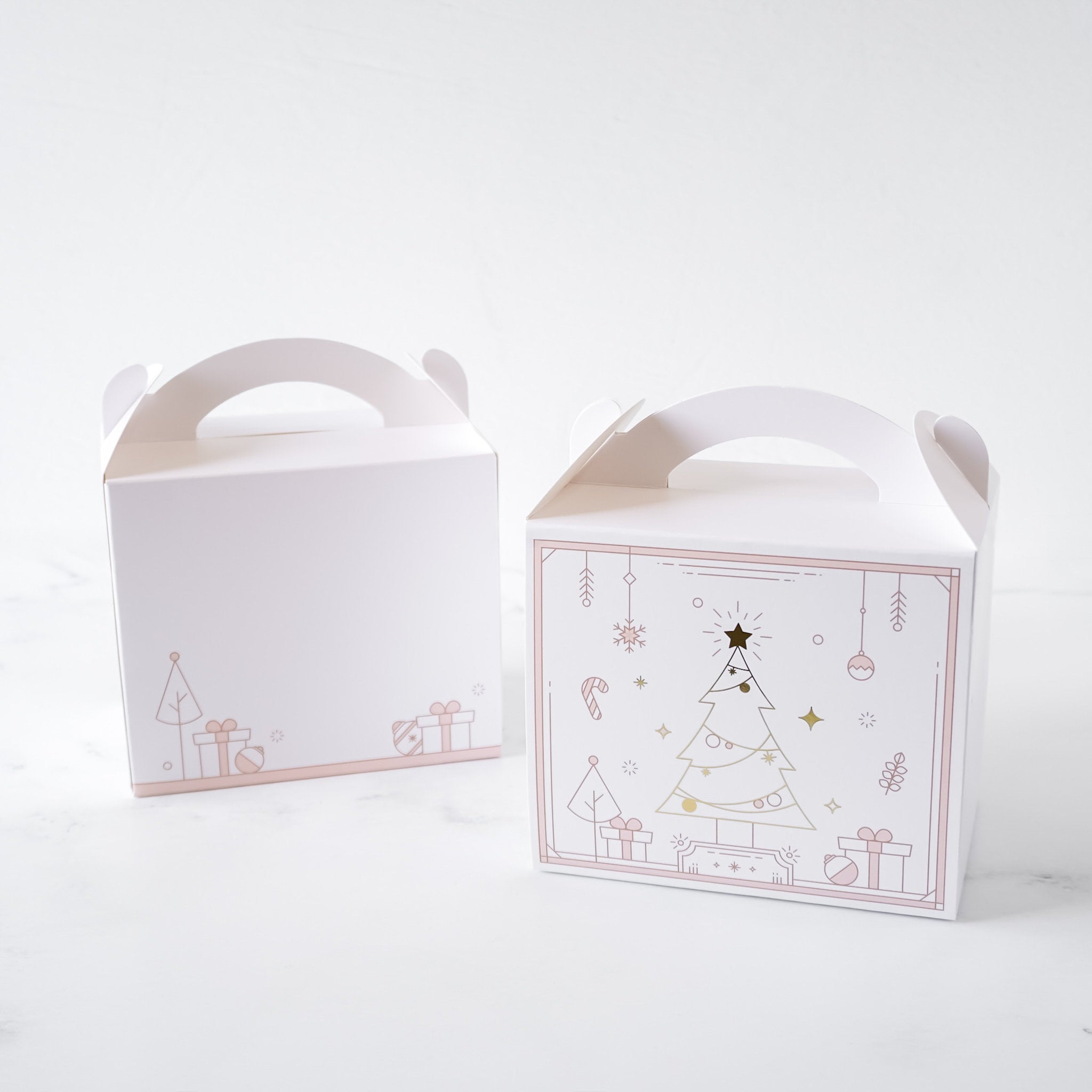 Two white gable boxes with Christmas tree designs on a white background