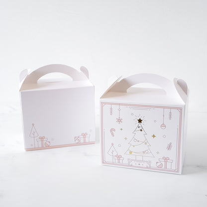 Two white gable boxes with Christmas tree designs on a white background