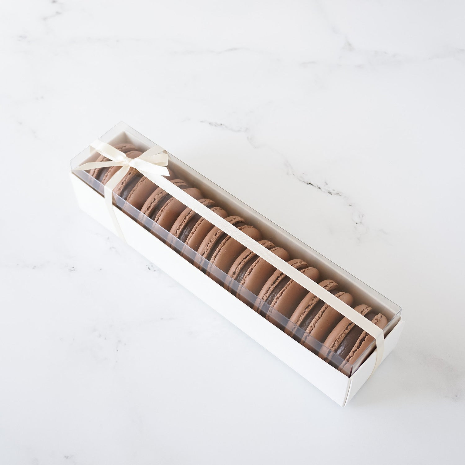 white macaron box, chocolate macarons