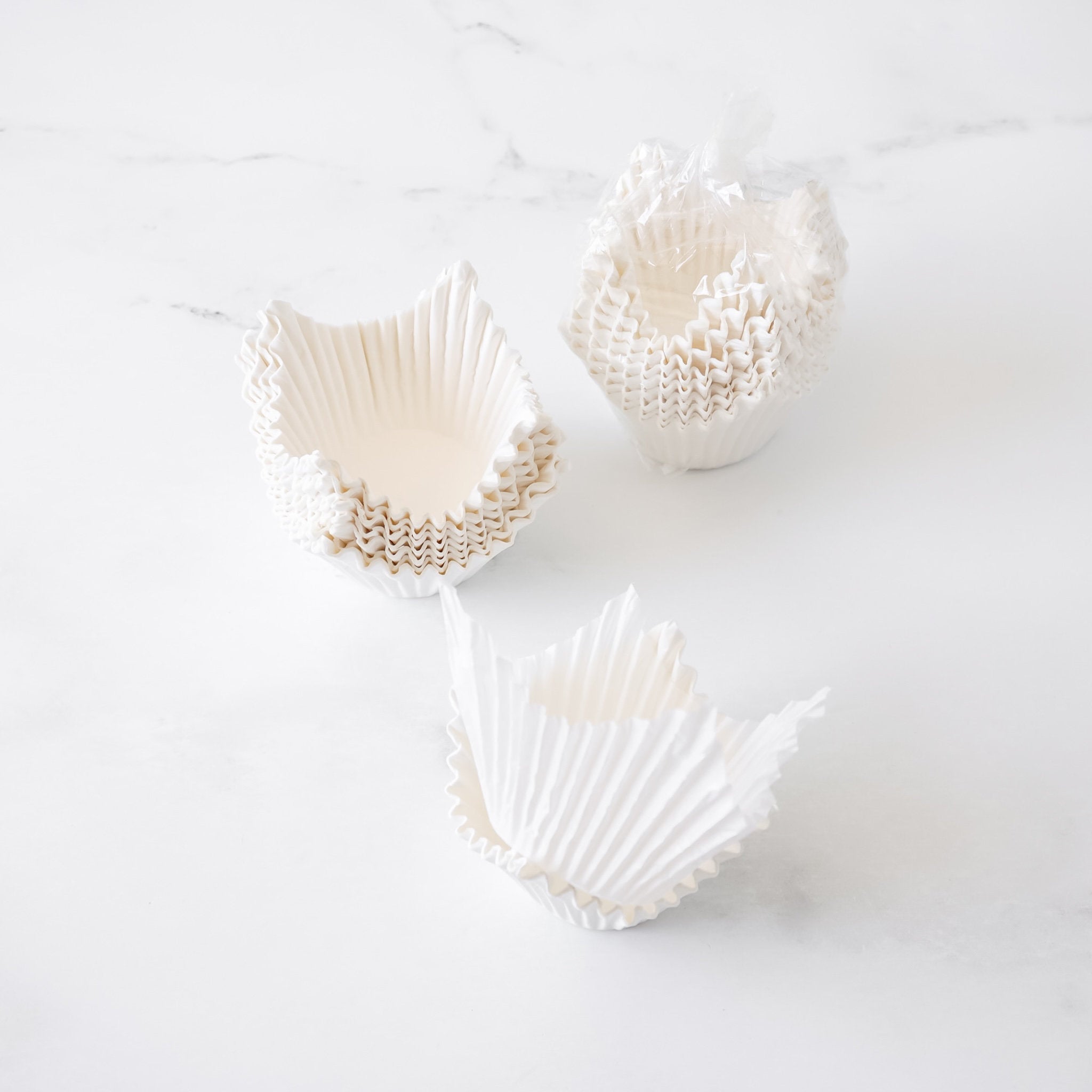 white cupcake liners on a white background