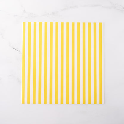 Yellow striped deli paper on a white background